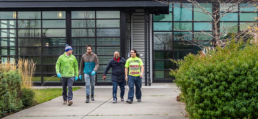 Students walking outside a building on campus