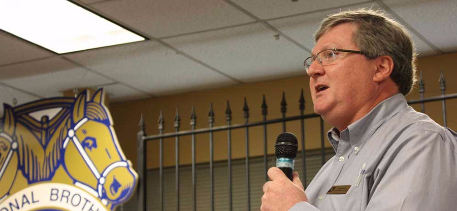 presenter/instructor holding a microphone