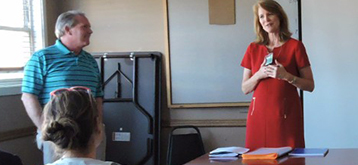 woman presenting an award at presentation/training session