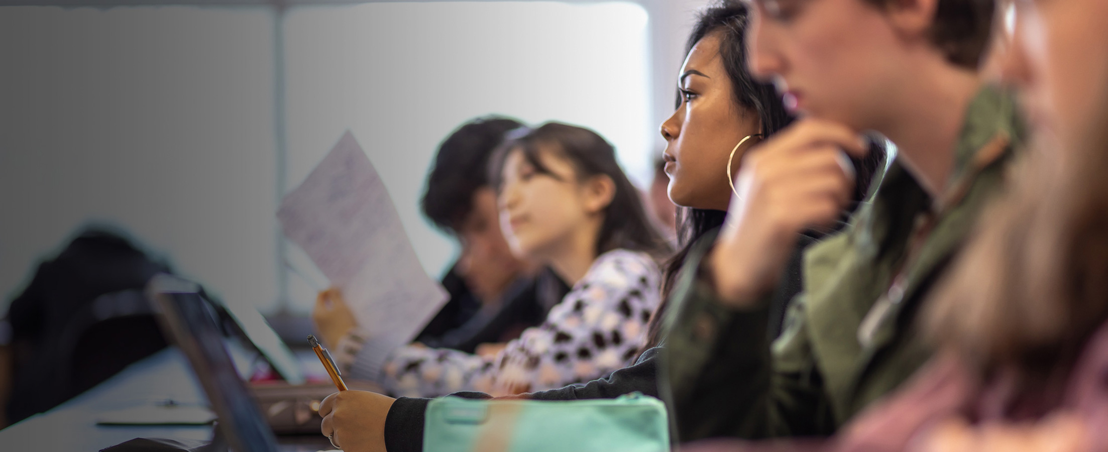  South Seattle College students in class taking notes 