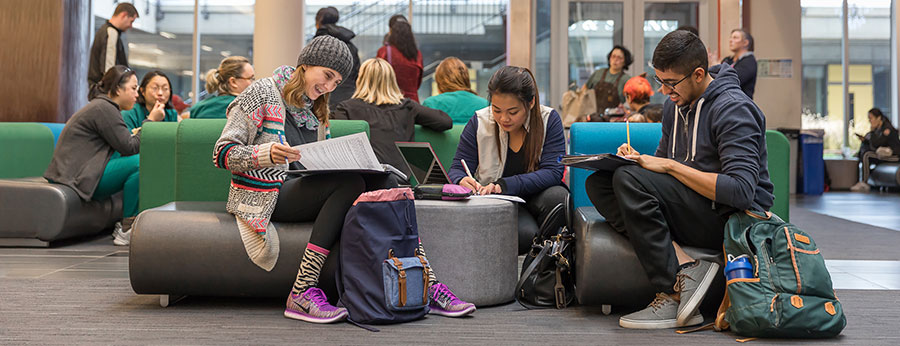  North Seattle College students working together in open study area 