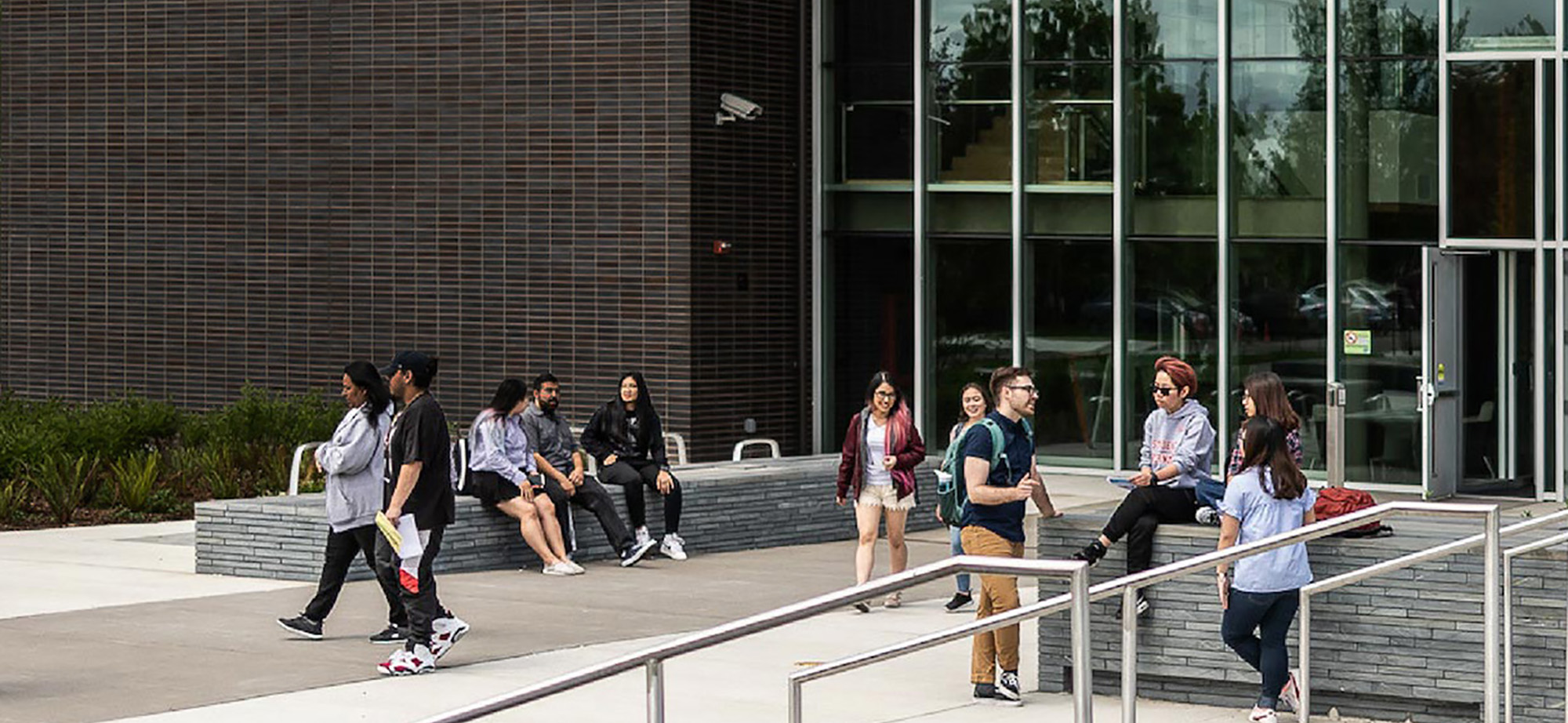 students outside a building on the South campus