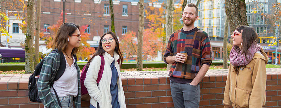 Seattle Central College students visiting on the lawn
