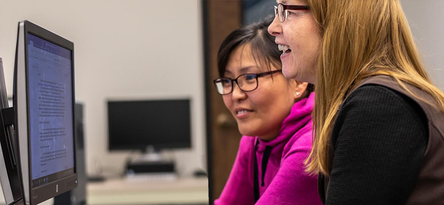  women at a computer screen 