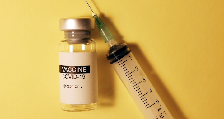  vaccination bottle and syringe 