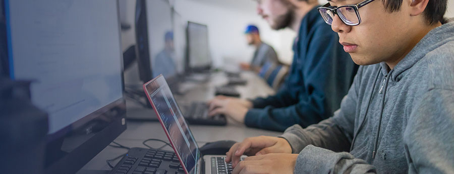  students at computers in a lab 