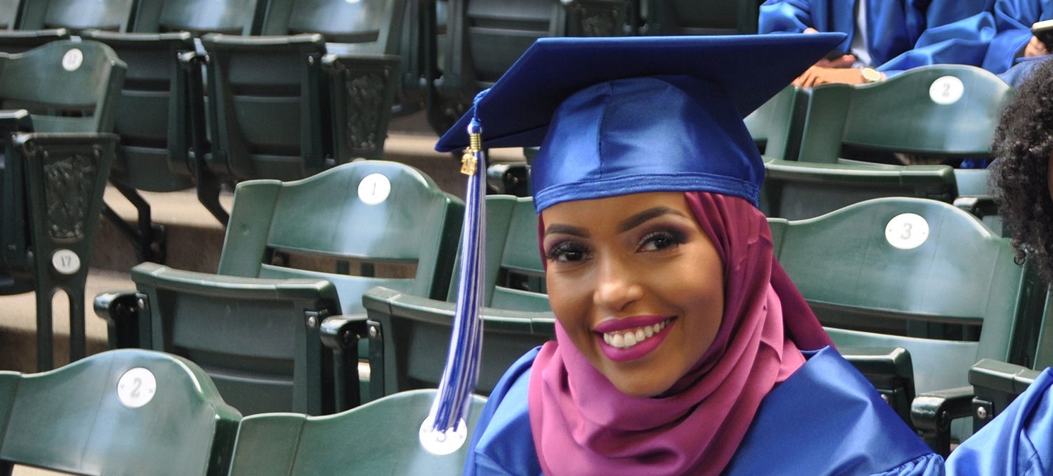  a smiling student at commencment 