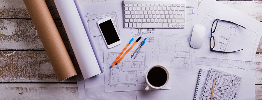  White and grey items on desk with cup of black coffee 