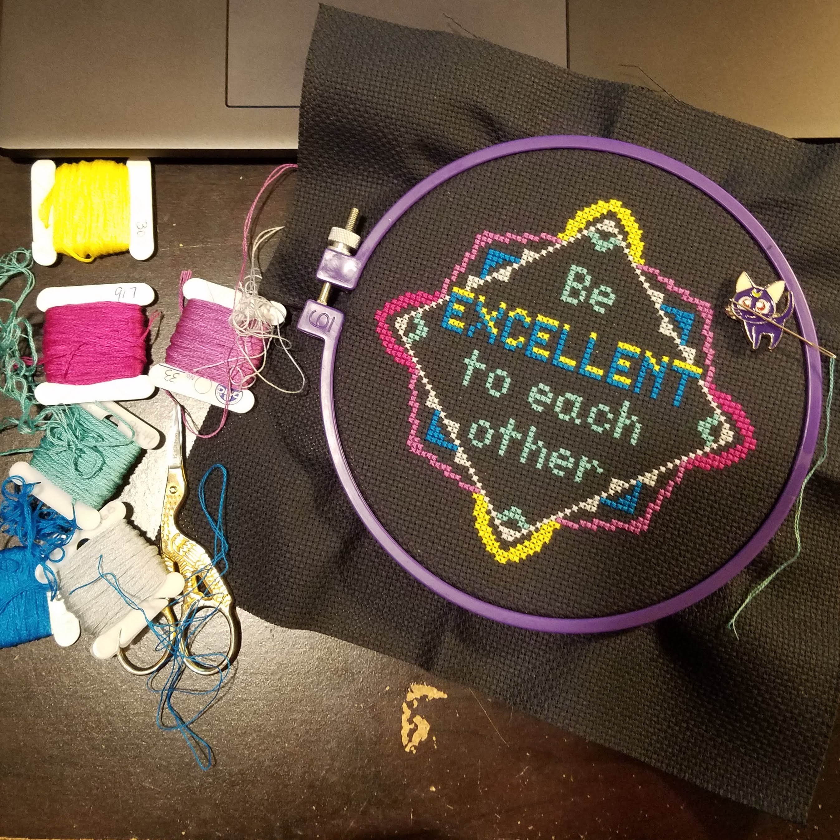 Needlepoint that reads Be Excellent to Each Other