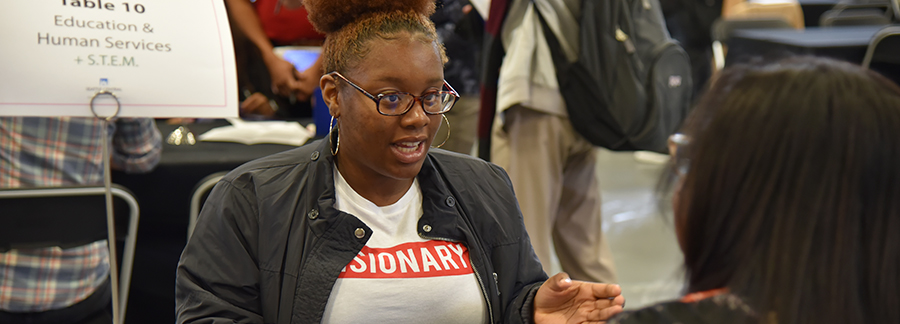  Mentor talking to student from Connect Central event 