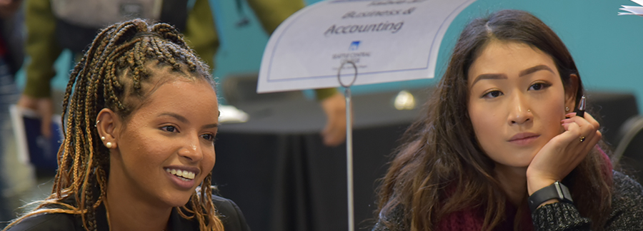 Two students talking with an industry professional at Connect Central