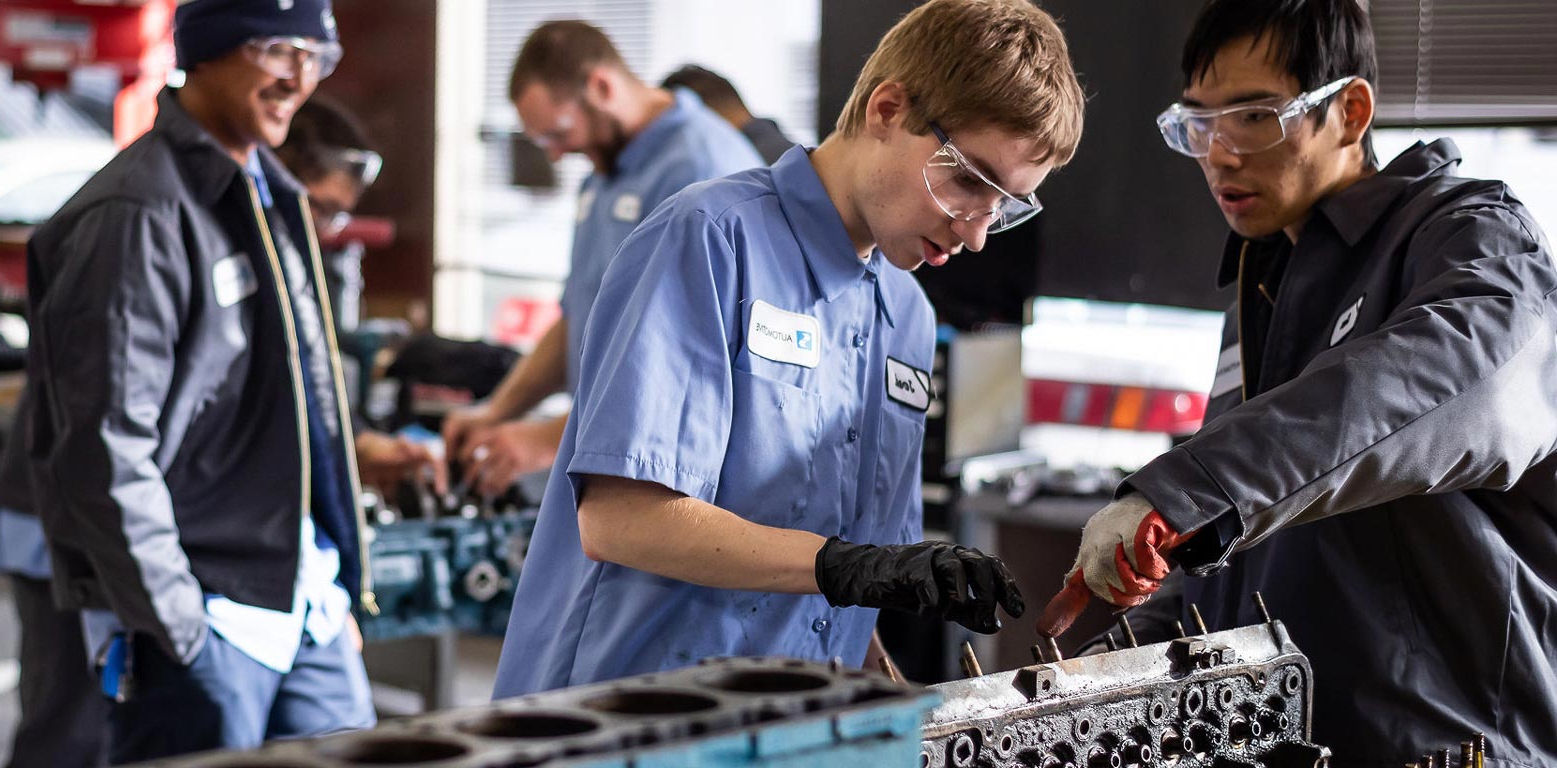  students working in an automotive tech lab 