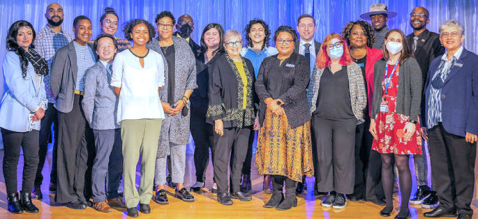 a group of twenty people, members of the ACO team