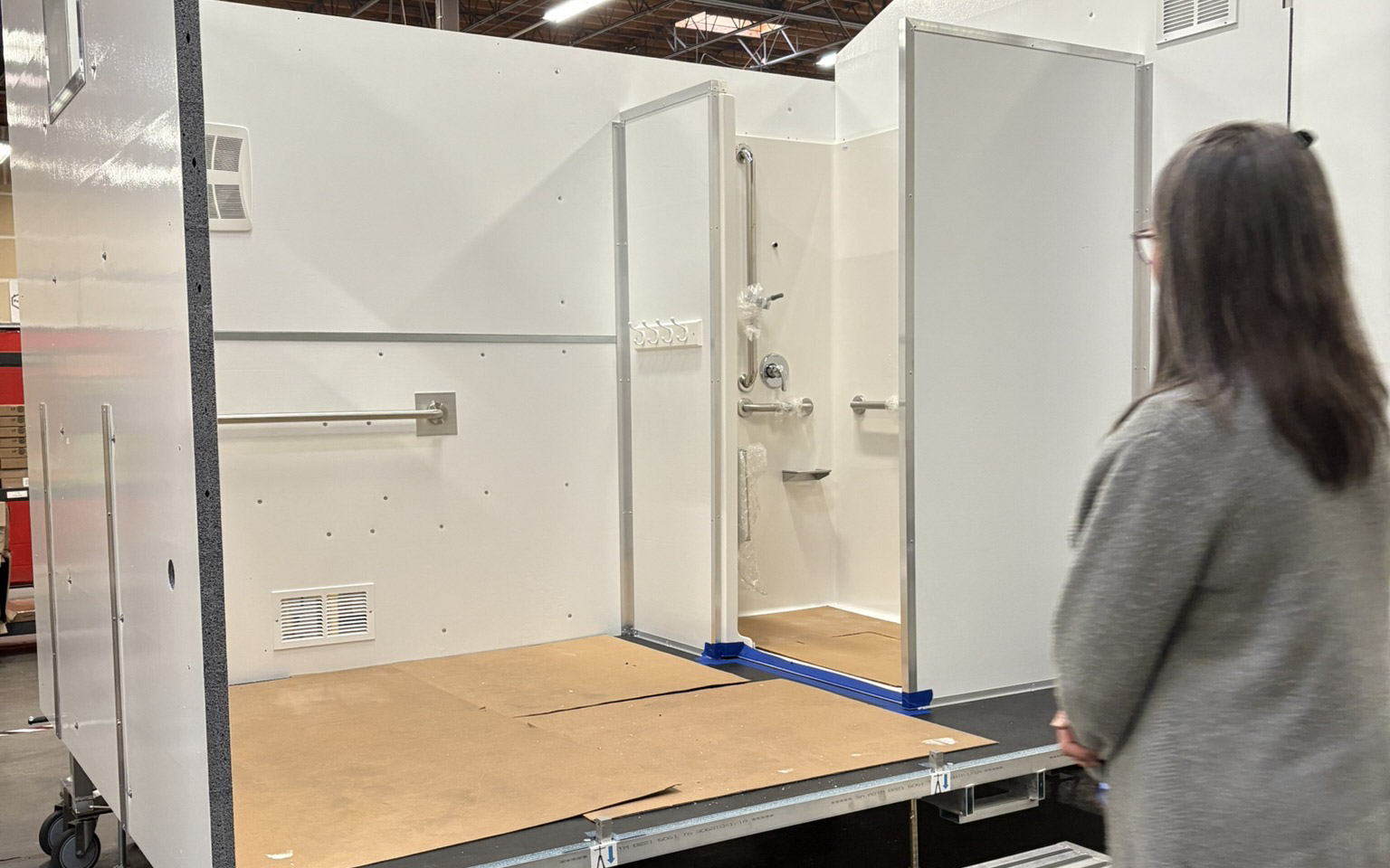 Seattle Colleges' Liz Strongman observing the inside of a shelter.