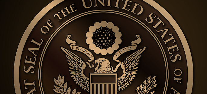 The federal seal of the U.S. - an eagle holding a ribbon with 'e pluribus unum'