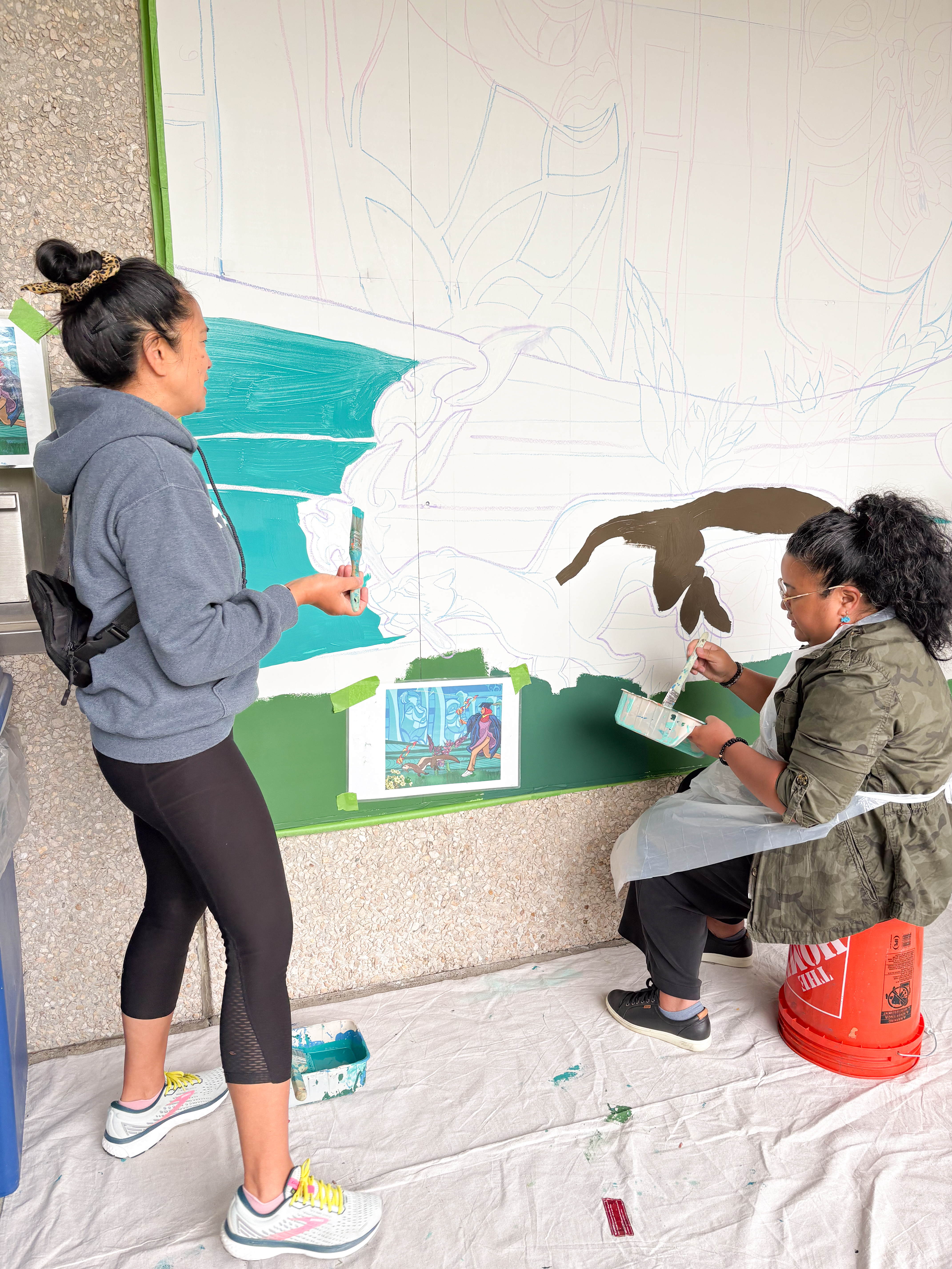 South Seattle College President (left) and Seattle Colleges Chancellor (right) at mural in South Seattle College.