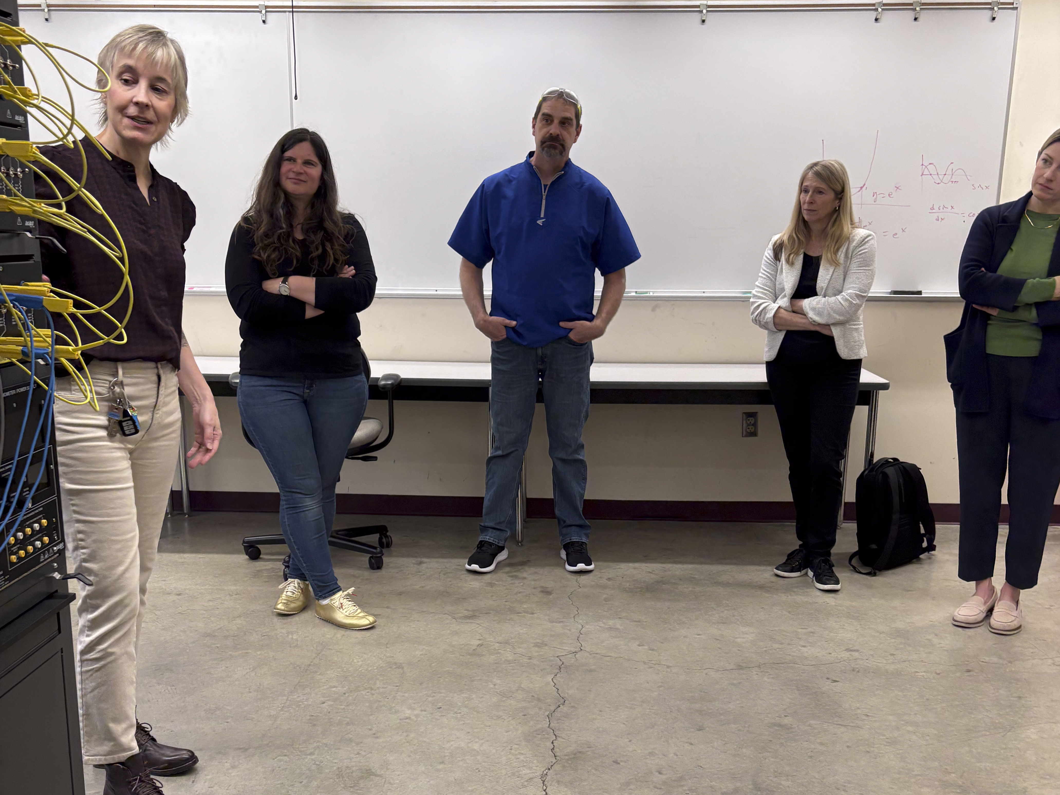 North Seattle College delegates and Boeing representatives examining equipment at North Seattle College.