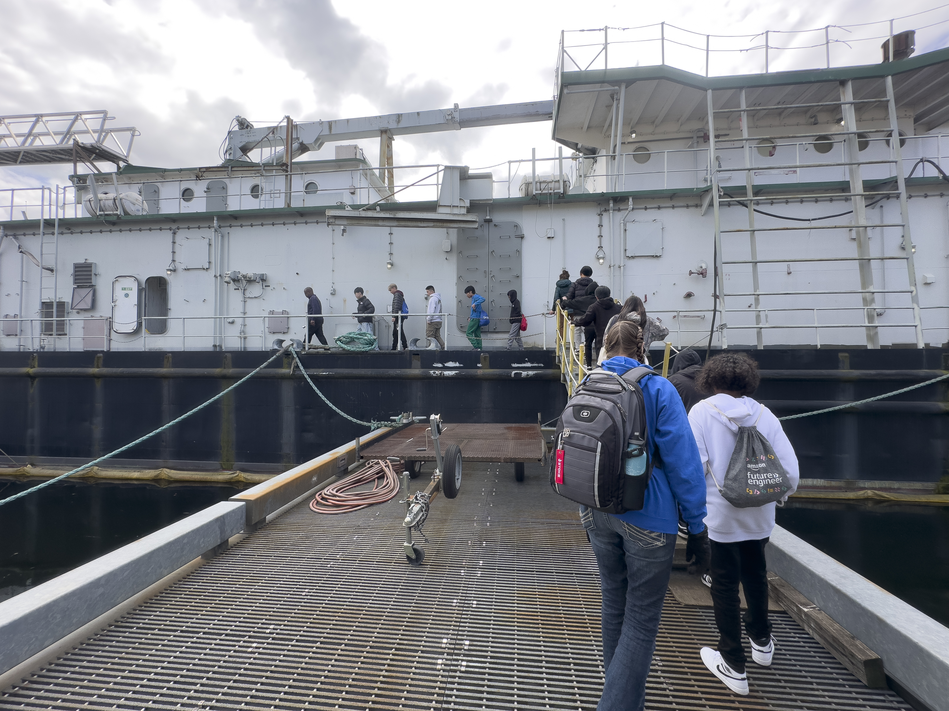 Students boarding the USAV Vulcan.