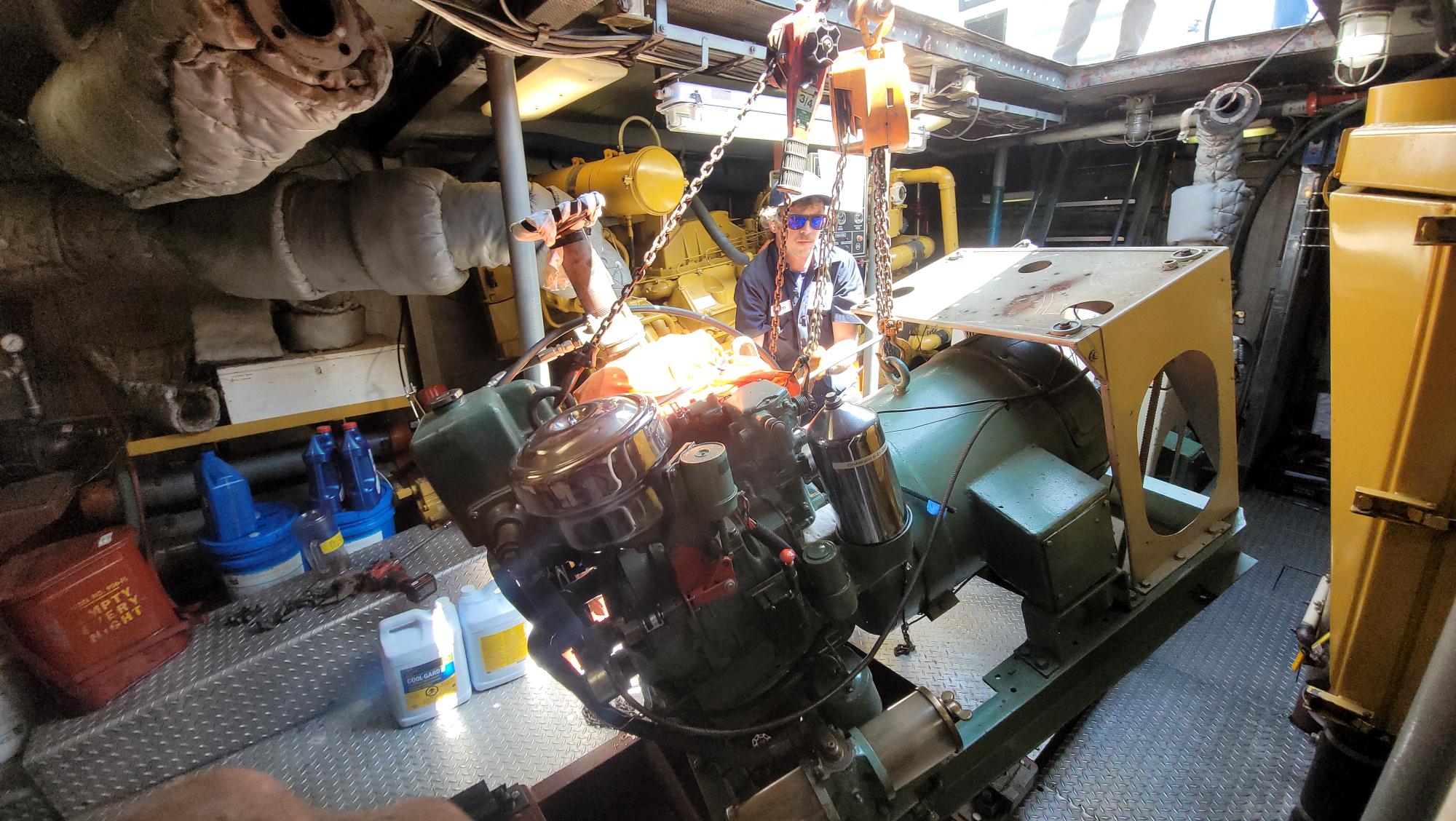 Process of installing new generator for one of Seattle Maritime Academy's "floating classrooms".