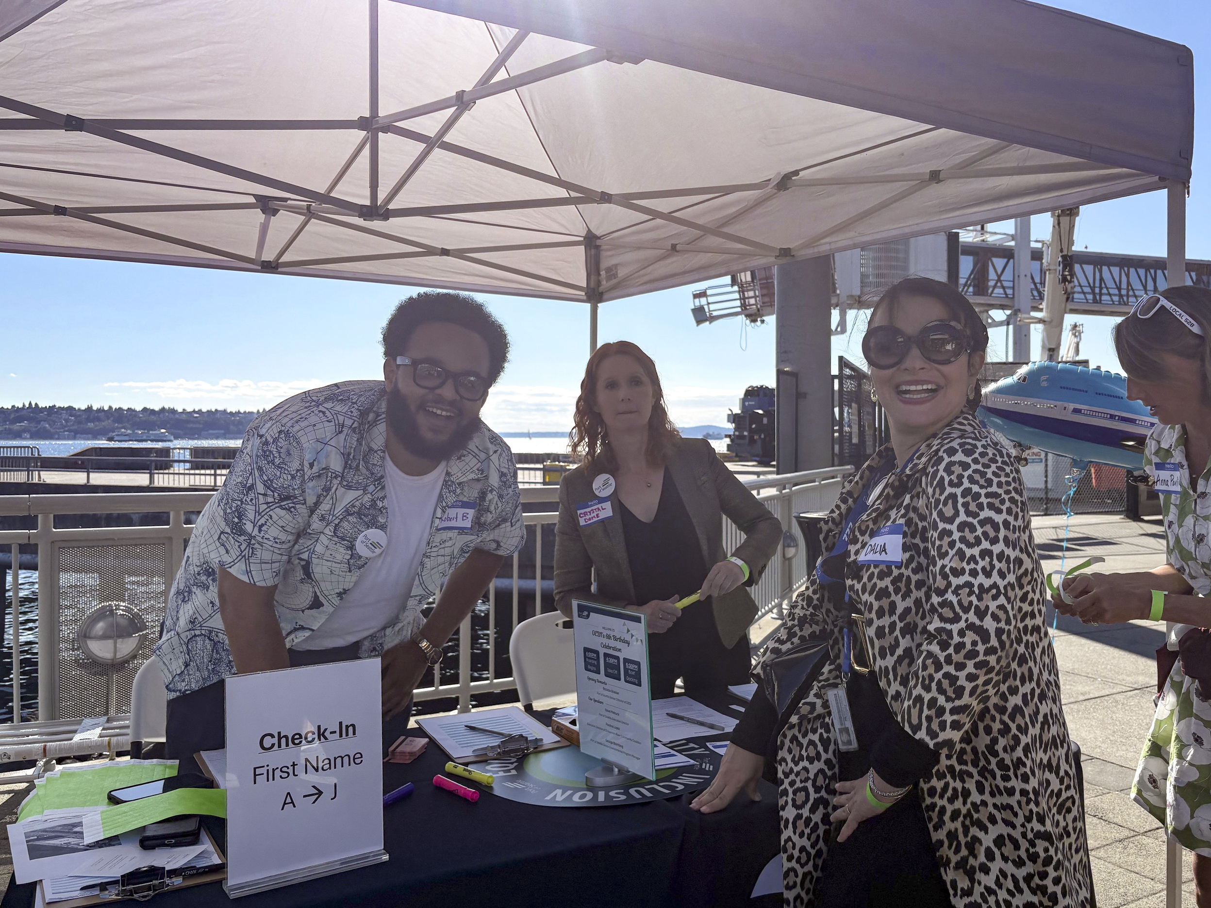 Dr. Dalia Sherif (Senior Executive Director of District Workforce Development) with participants at the Port of Seattle DEI Office's 6th Anniversary celebration.
