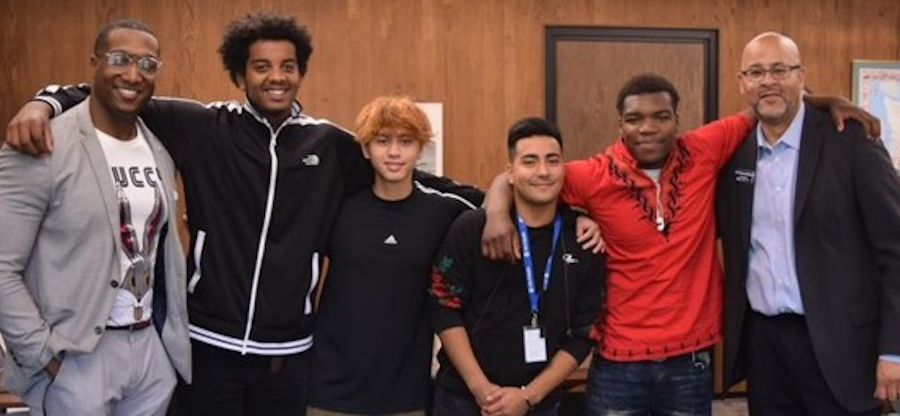 Group of three mentors and three student mentees working together and smiling