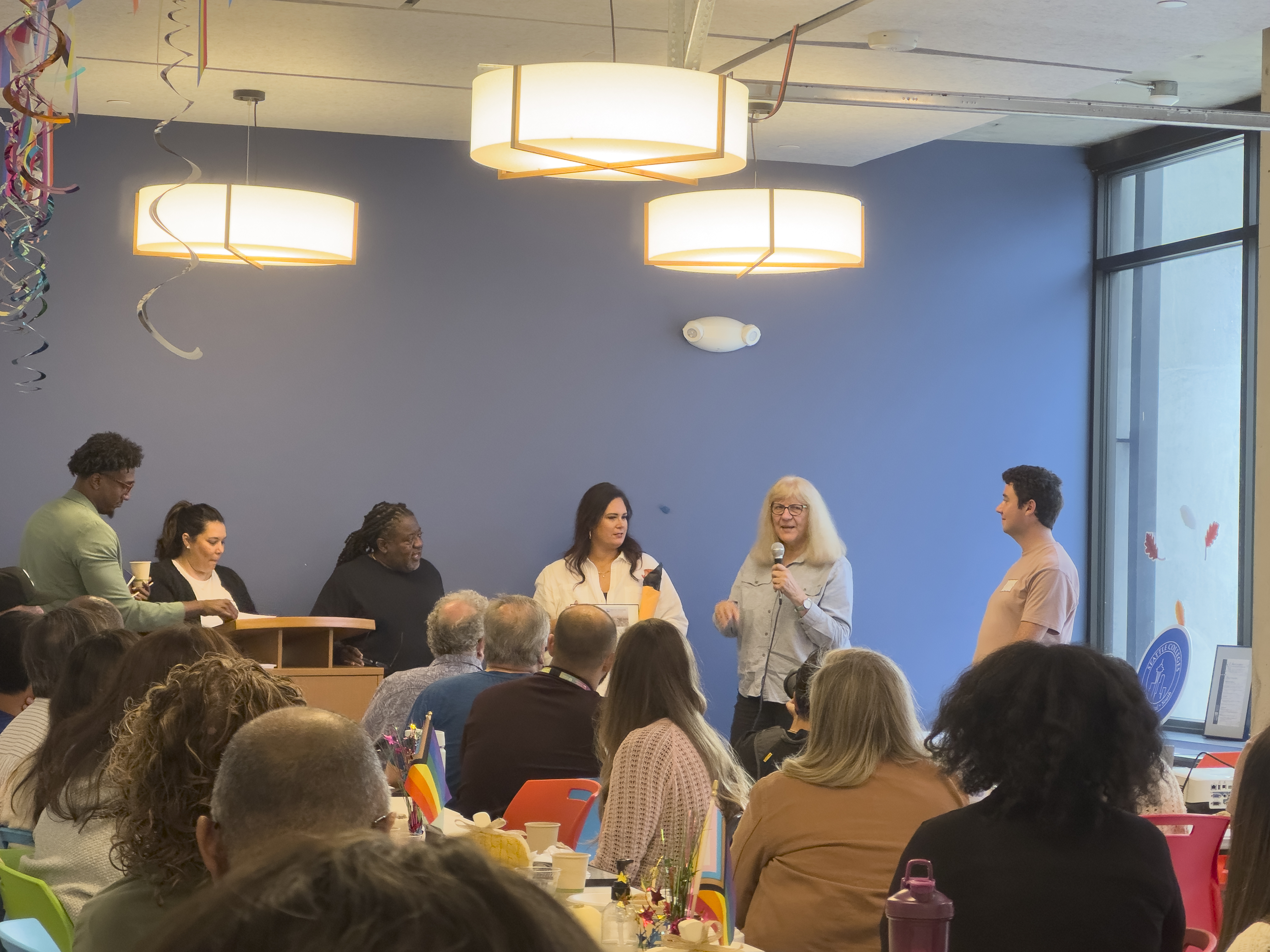 Paulette Eickman, Lead Graphic Designer, being honored for her years of service