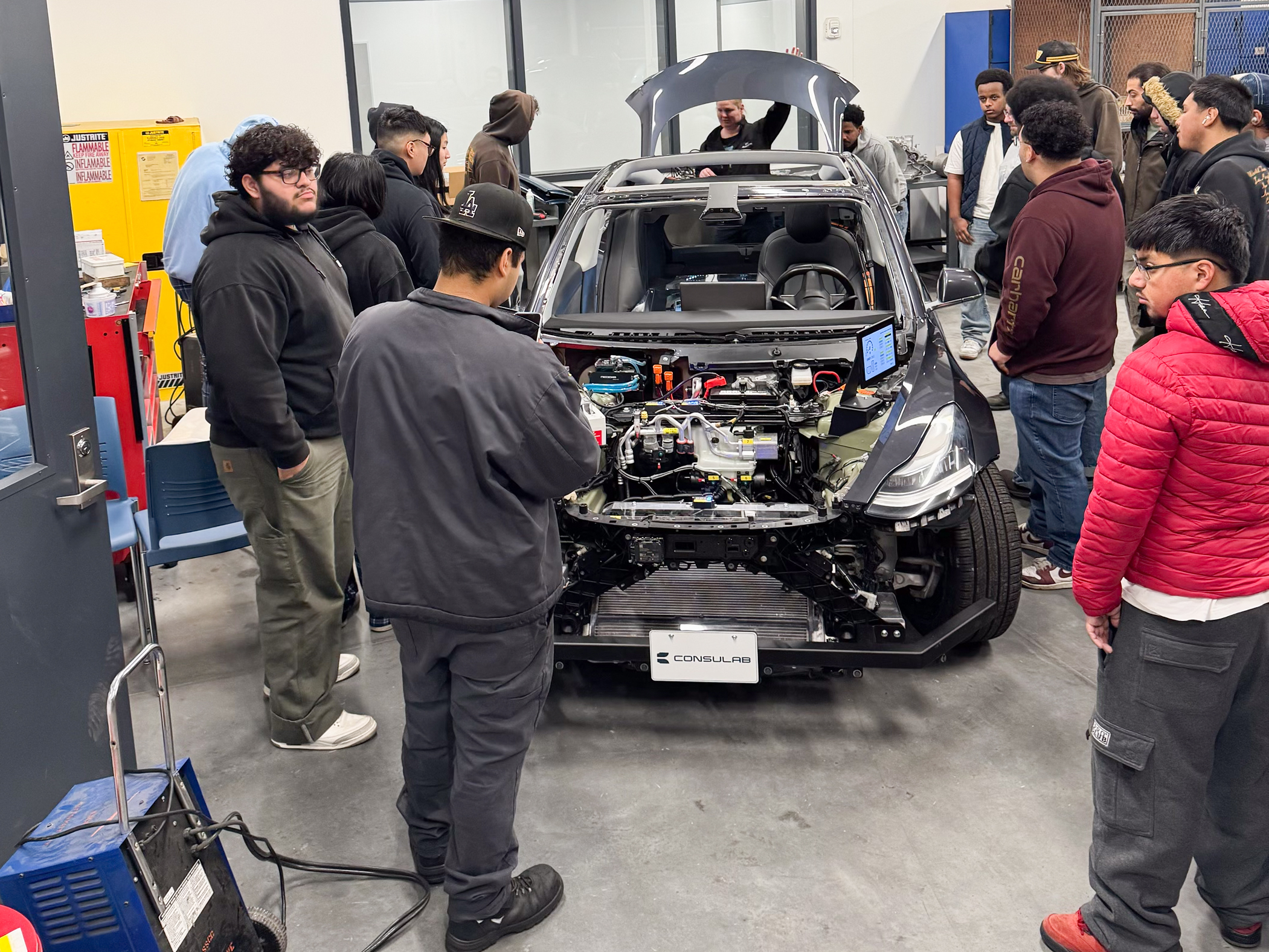 The newly acquired Consulab EV Trainer surrounded by students at South Seattle College