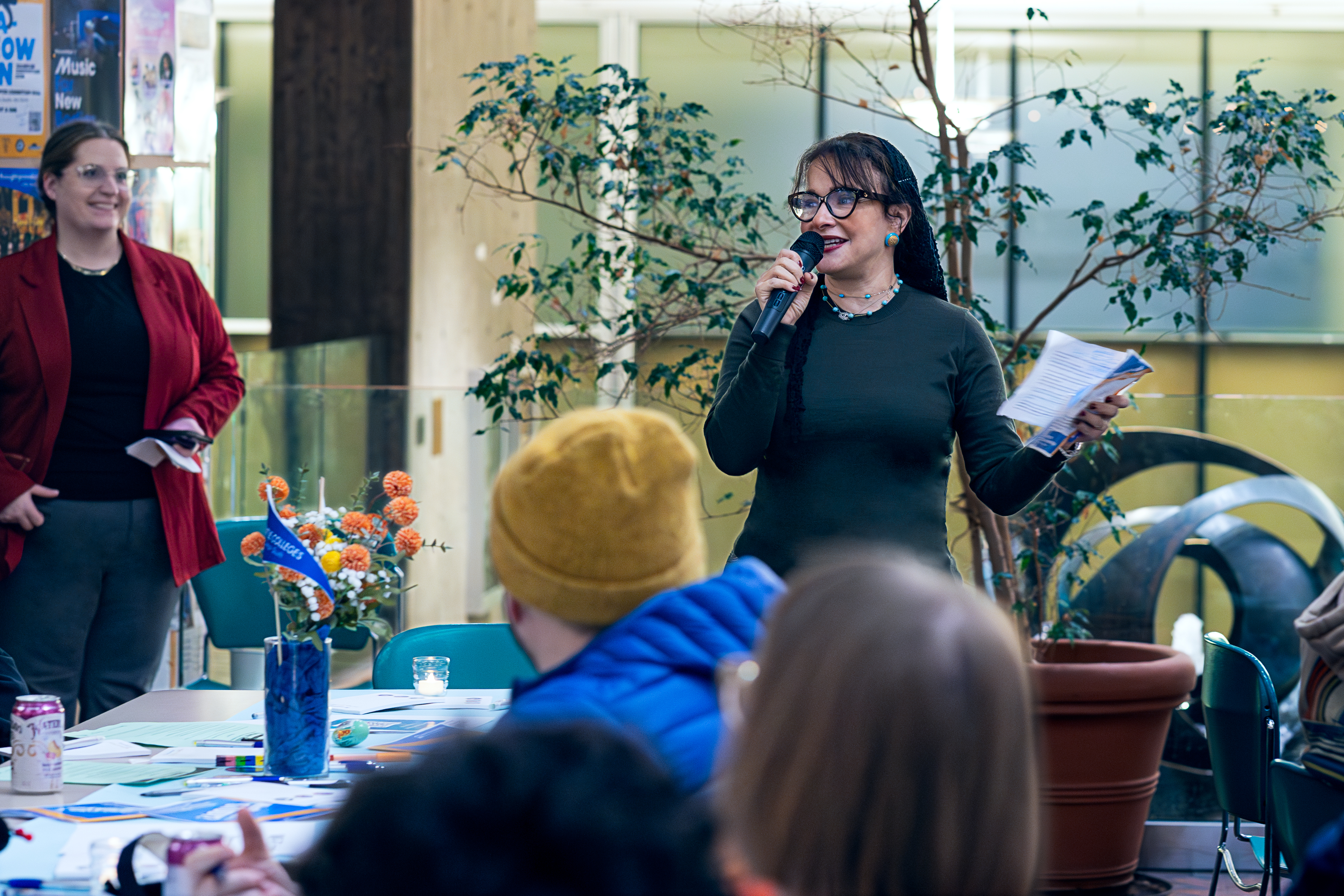 Dalia Sherif speaks to attendees at family night