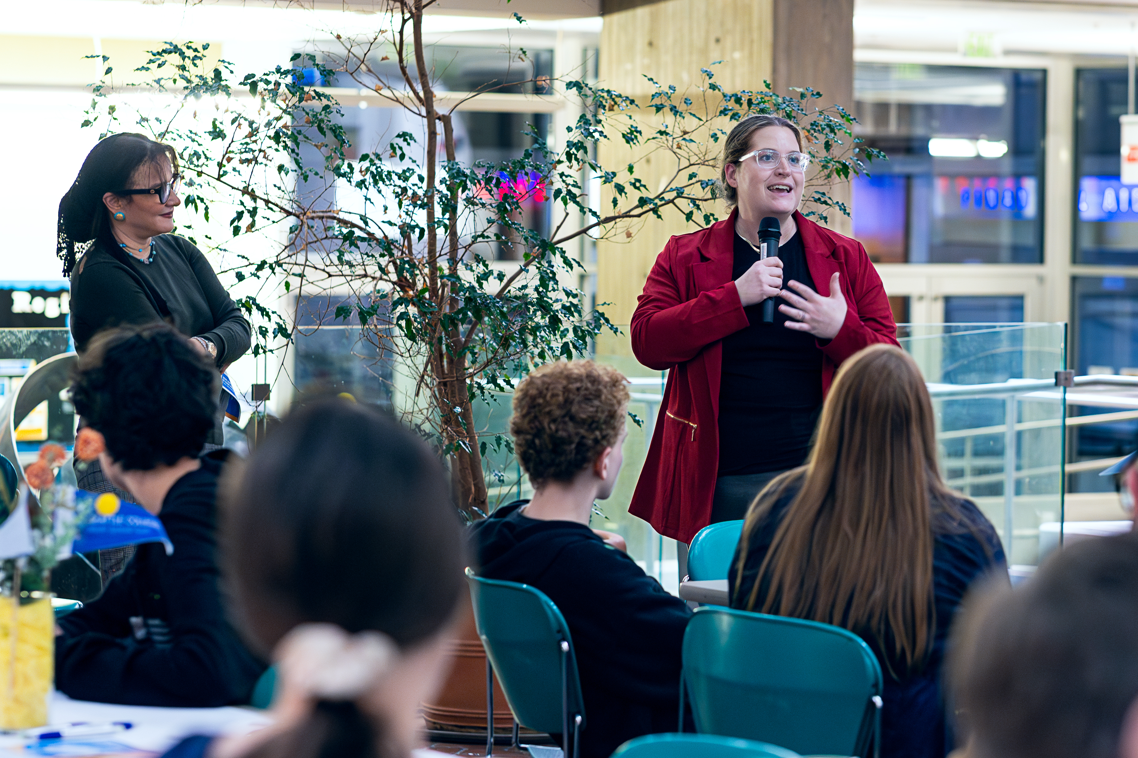 Dalia Sherif and other family night attendees listening to speaker