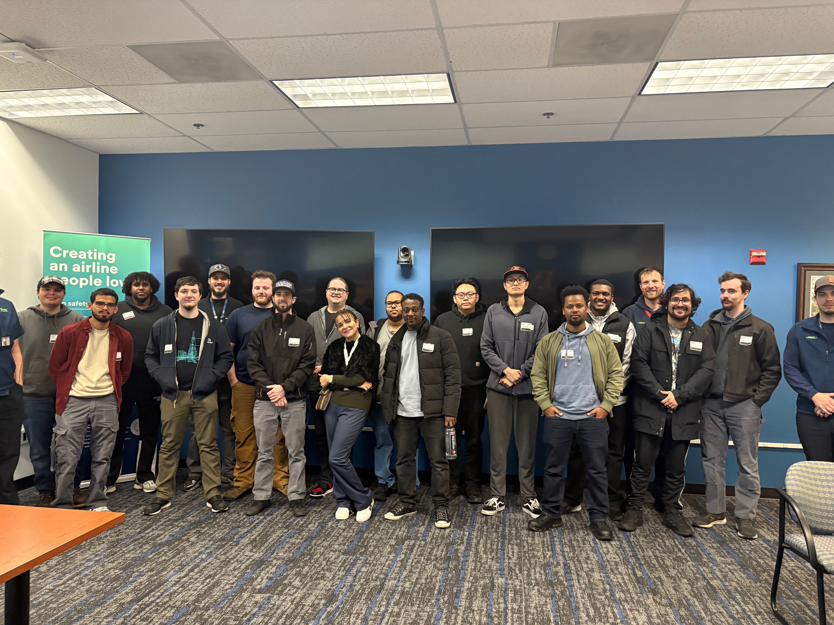 Group of AMT Mentorship students posing with representatives from Seattle Colleges and Alaska Airlines