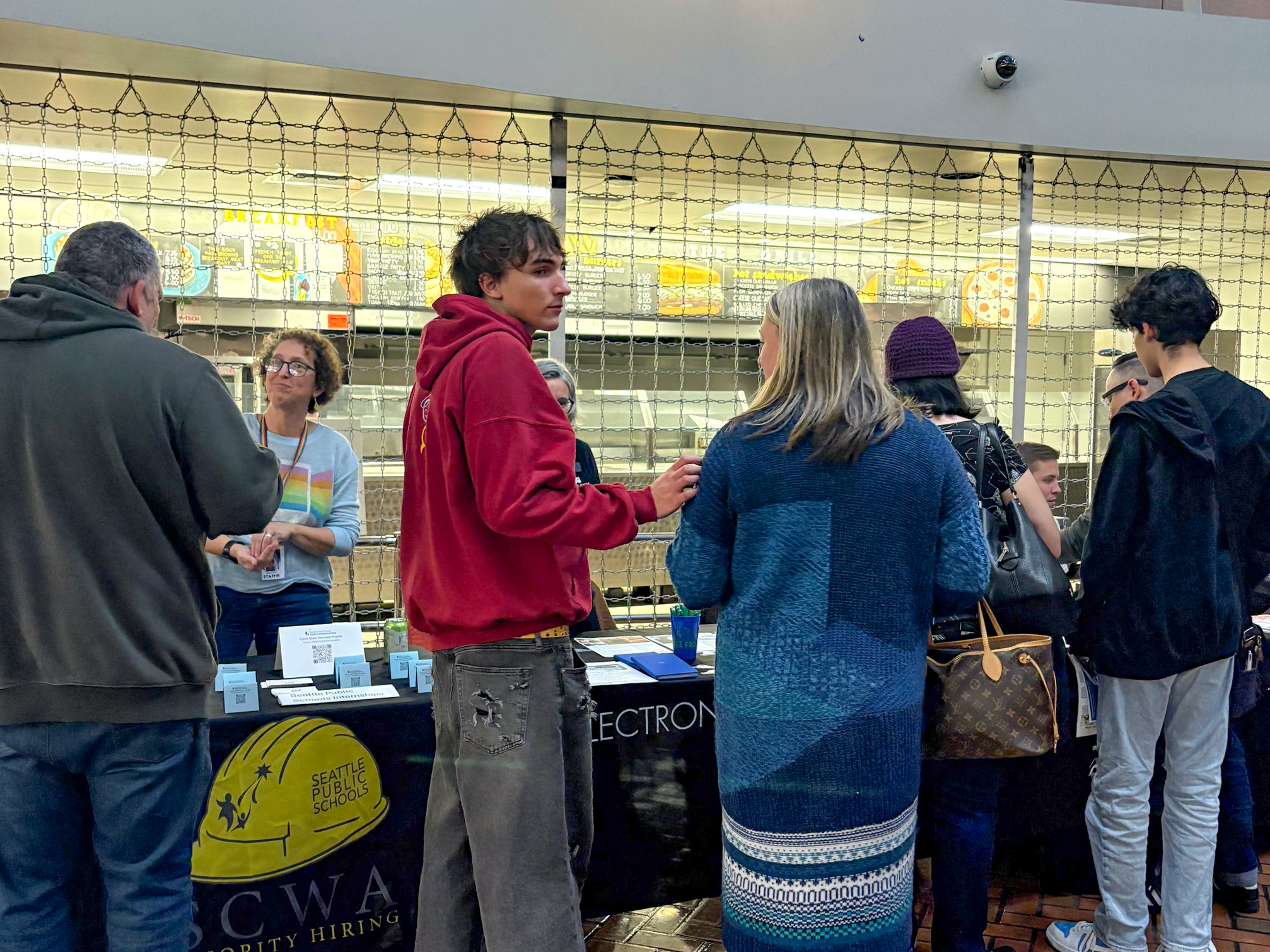 a prospective student at the tabling portion of the Seattle Central College Family Night