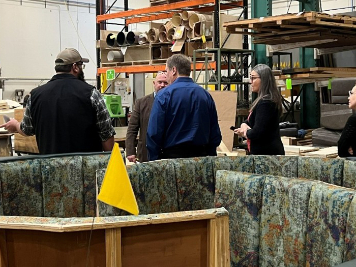 Members of QA Group conversating in factory