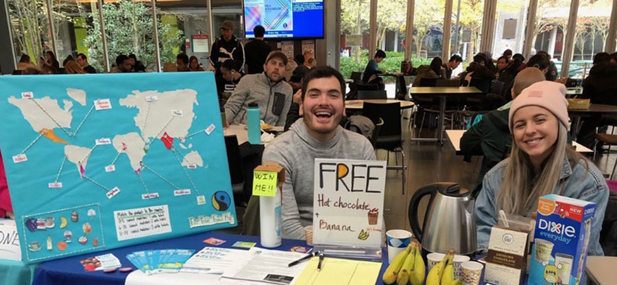 Students at an information table in the North Seattle College common area.
