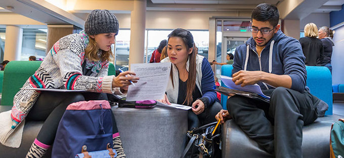 North Seattle College students working together in open study area