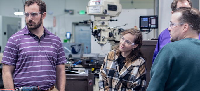 A group of people in a technical training setting