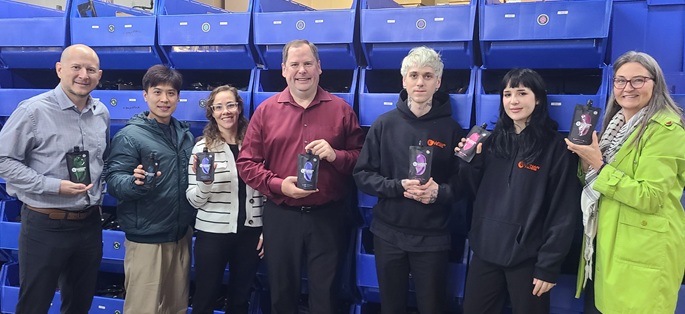 staff members with clients holding a hair dye product
