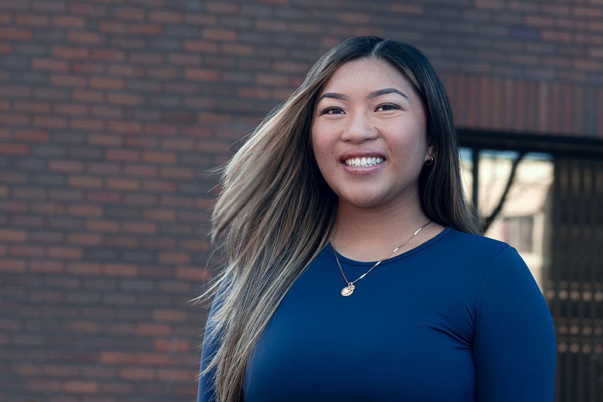 Isabella Caldejon smiling in front of Seattle Central College exterior