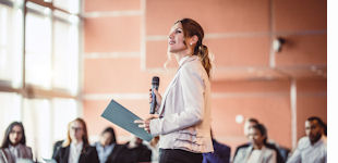 woman presenting to a group of people