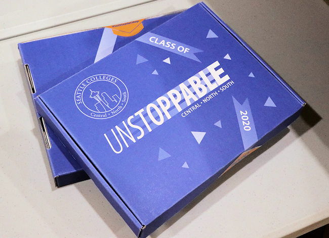 the box graduates will receive for their commencement in a box. it is blue and has "Unstoppable" printed on it