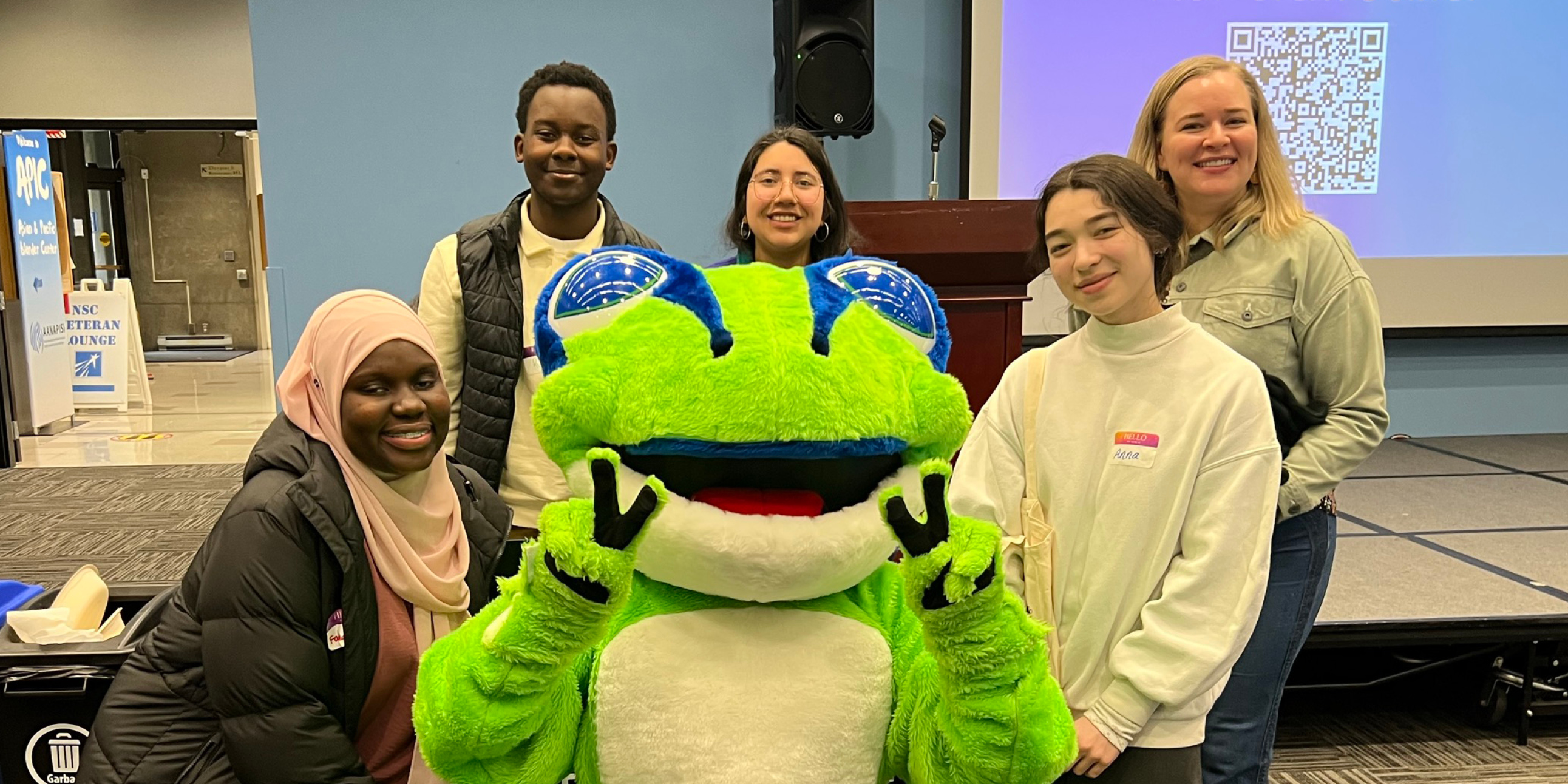 This year the Seattle Colleges District Workforce Development Office hired interns from among Seattle Promise students from all three campuses. In this photo, from left to right, posing with North Seattle College's Tree Frog Mascot, Fatuma, Ryan, Rosalyn and Anna (Not pictured: LaRaya). Accompanying them, Workforce Development Office's High School Initiatives Manager Caroline O'Connell (far right).
