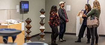 students in art gallery looking at exhibit