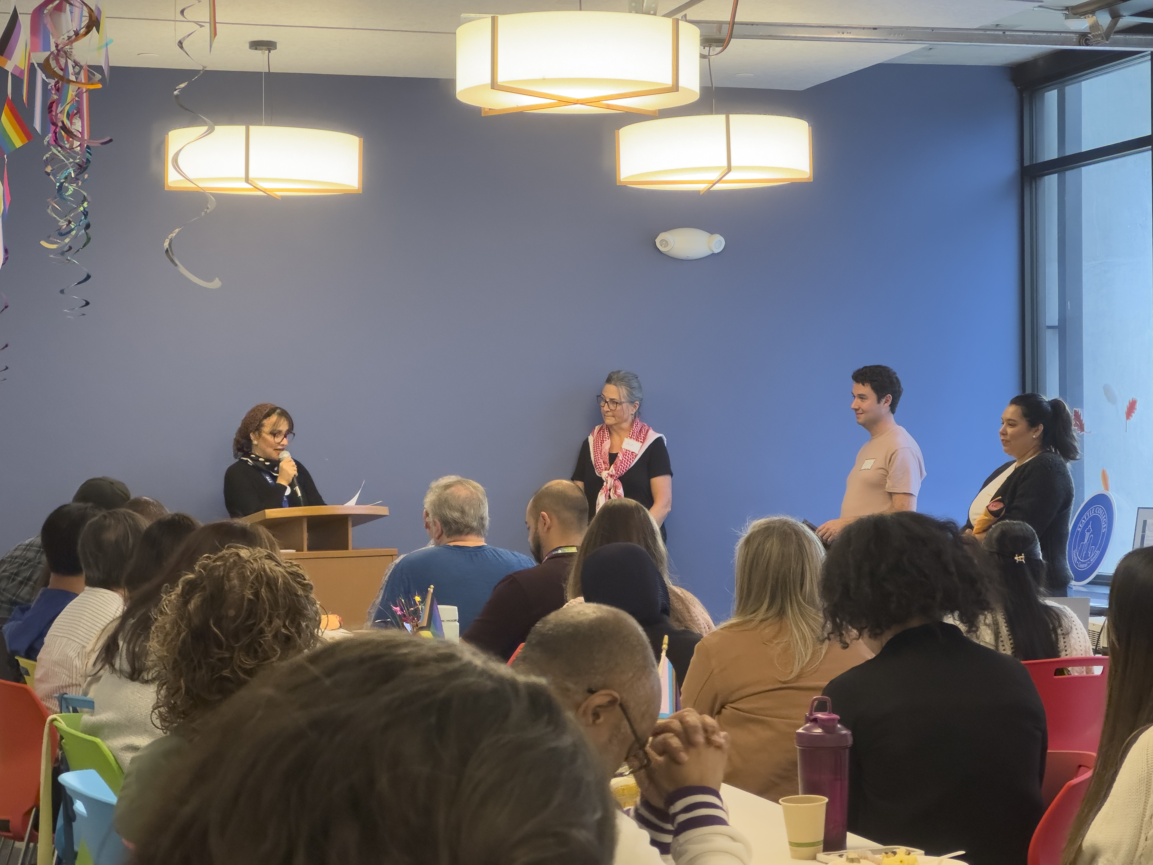 Dr. Dalia Sherif, highlighting Liz Strongman's accomplishments as her 25 years of service were conmemorated.