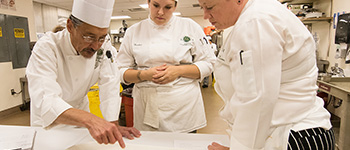 students and chef preparing food for Square One